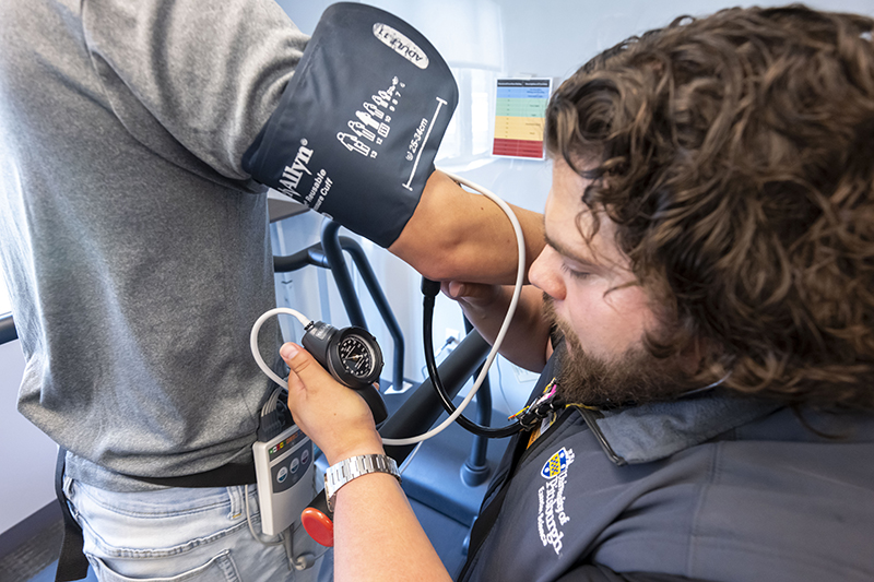 Researcher measuring blood pressure