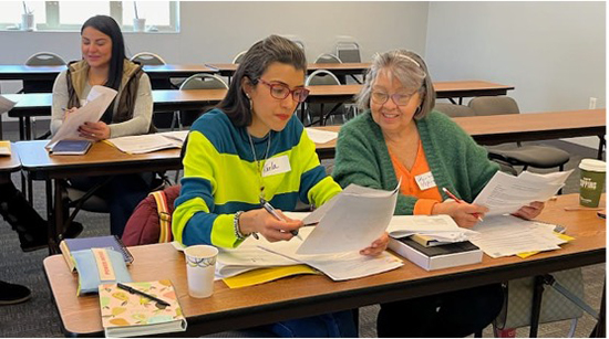 Community health workers reviewing training materials