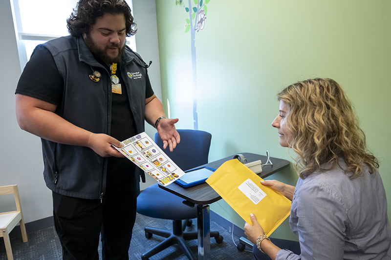 Researcher sharing paperwork with a study participant