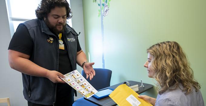 Researcher sharing paperwork with a study participant